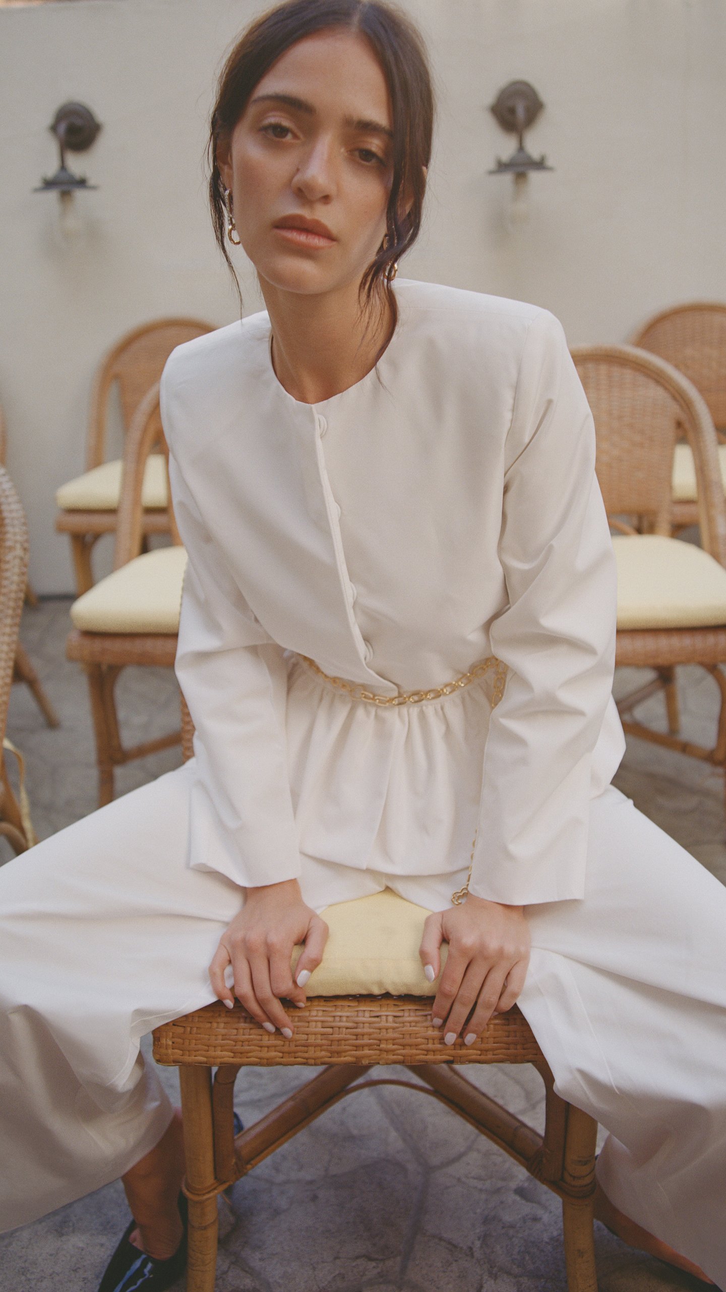 White peplum top with chain belt from Maje White Edit collection